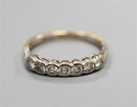 A seven-stone diamond and 18ct gold half-hoop ring and a similar pair of diamond stud earrings, ring size M/N.